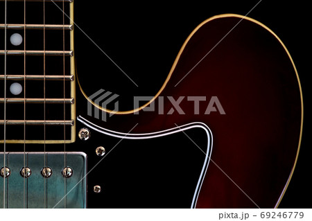 Electric Guitar Closeup View on a Black Background Electric Guitar Closeup View on a Black Background 69246779