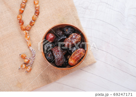 the concept of ramadan, fresh date fruit in a bowl on table  69247171
