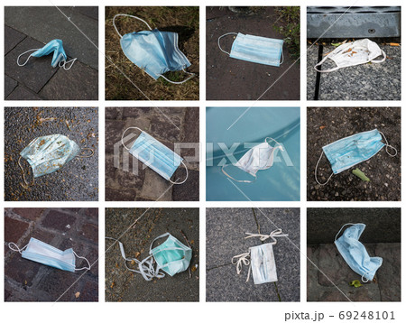 different view of  medical mask abandoned in the street during t 69248101