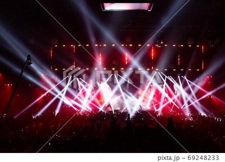 Stage illuminated by beautiful rays of lighting equipment. 69248233