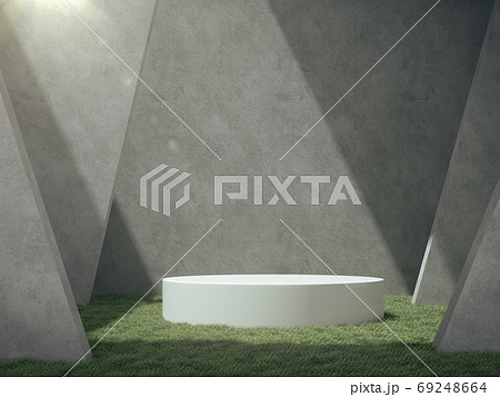 White pedestal for product show in concrete room with lawn. 69248664