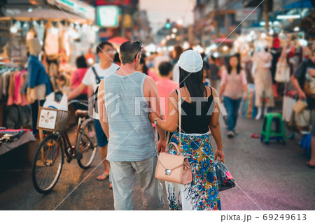 backside of couple local travel and shopping at thailand night m backside of couple local travel and shopping at thailand night m 69249613