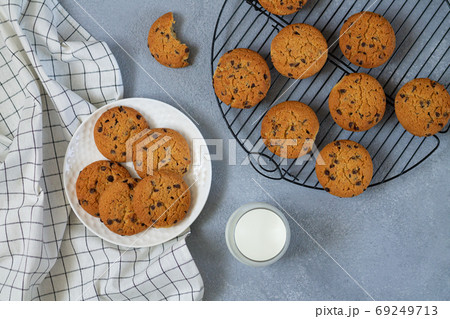 Freshly baked chip chocolate cookies and glass of milk on stone table top view 69249713
