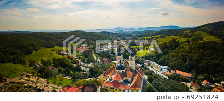 Aerial panoram of Baroque Mariatrost Basilica on top of the Purberg hill in Mariatrost, a district of Graz. 69251824