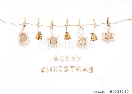 Christmas pattern made and of handmade knitted toys on white background. Merry Christmas. flat lay, top view 69253119