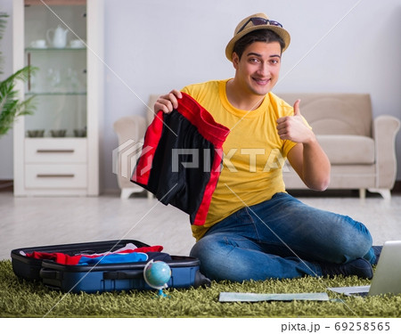 The man planning his vacation trip with map The man planning his vacation trip with map 69258565