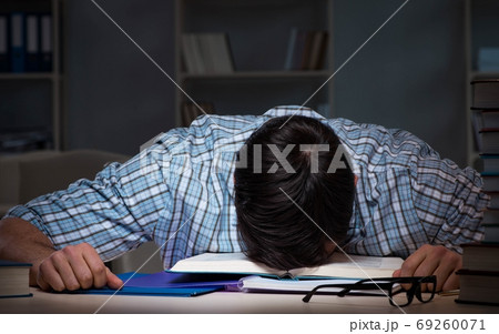Student preparing for exams late at night Student preparing for exams late at night 69260071