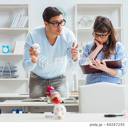 Two medical students studying in classroom Two medical students studying in classroom 69267295