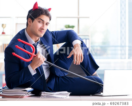 Devil angry businessman in the office Devil angry businessman in the office 69267383