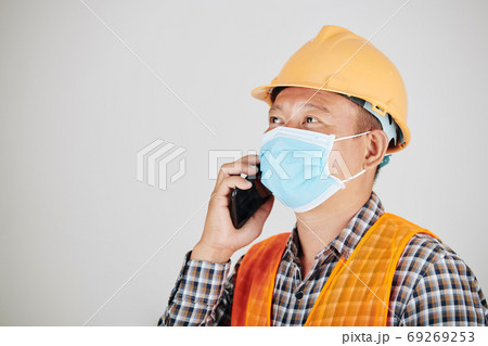 Construction worker calling on phone Construction worker calling on phone 69269253