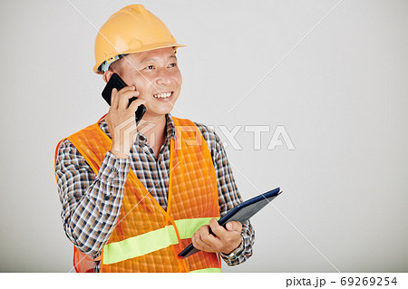 Contractor talking on phone Contractor talking on phone 69269254