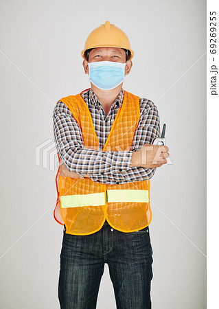 Contractor in safety vest and medical mask Contractor in safety vest and medical mask 69269255