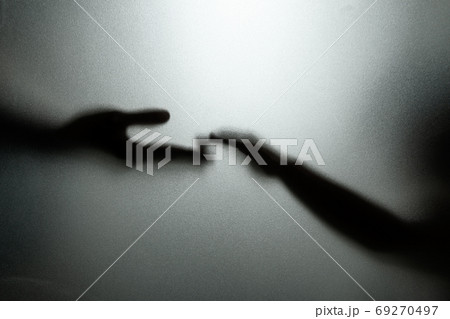 Ghost concept shadow of hand behind the matte glass blurry hand 69270497