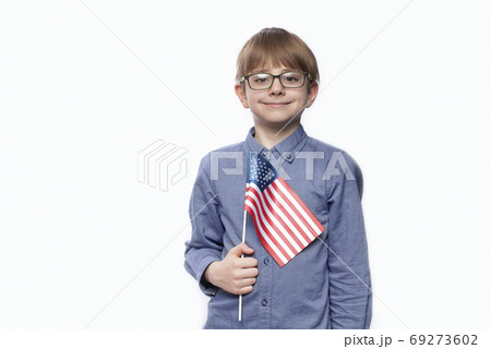 Teenager holding flag of America. Education in the USA. Training in United States. 69273602