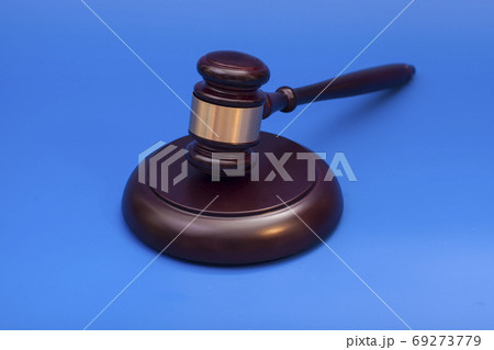 Wooden judge gavel and soundboard isolated on blue background Wooden judge gavel and soundboard isolated on blue background 69273779