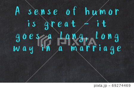 Chalk inscription of smart quote on black desk 69274469