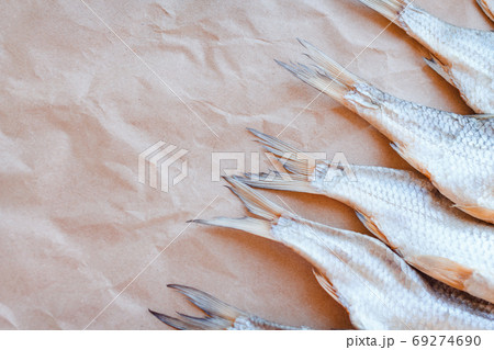 Dried fishes template banner on craft paper background with empty space for text. Flat Salted roach web cover backdrop. Seafood snack poster, flyer decorative design. Fish frame for promotion shop 69274690