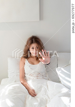 Beautiful Asian woman home in bed relax happy smile blonde female beautiful model casual lifestyle Beautiful Asian woman home in bed relax happy smile blonde female beautiful model casual lifestyle 69277077