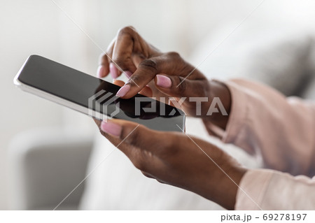 Unrecognizable African Woman Using Smartphone With Blank Black Screen, Mockup Image 69278197