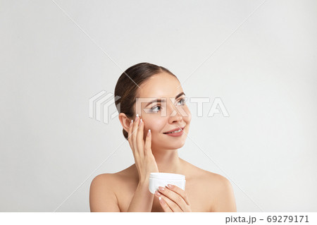 Woman Cleaning Face With White Pad.  69279171