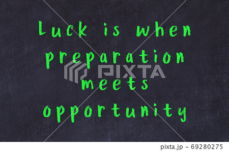 Chalk inscription of smart quote on black desk Chalk inscription of smart quote on black desk 69280275