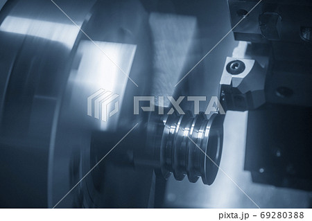 The  CNC lathe machine groove cutting. 69280388