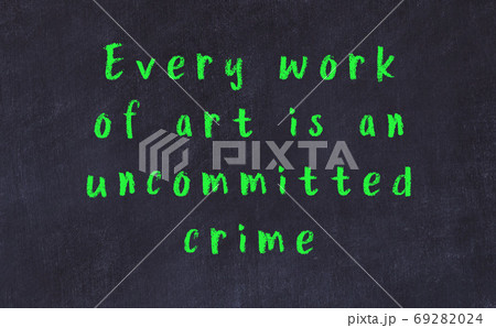 Chalk inscription of smart quote on black desk Chalk inscription of smart quote on black desk 69282024