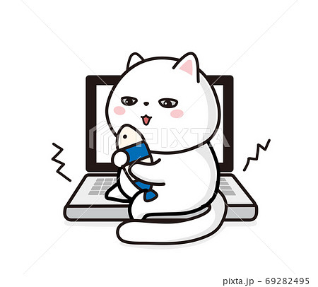 パソコンの上で遊ぶ白猫のイラスト素材