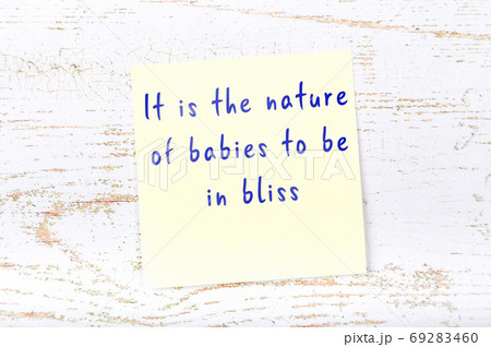 Wise quote on sticky note on wooden wall Wise quote on sticky note on wooden wall 69283460