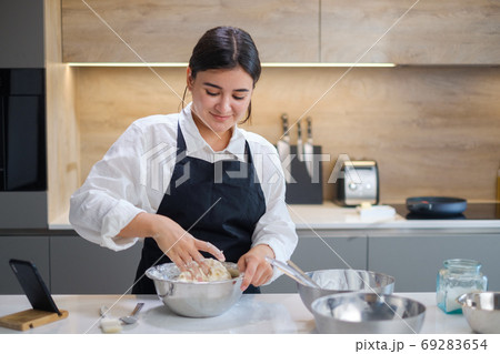 Smiling Young Baker Prepares Dough For Buns. 69283654