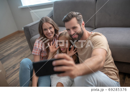 Happy family making photo and having fun 69285376