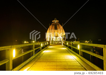 Submarine or diving gondola in Sellin. Night seabridge 69285403
