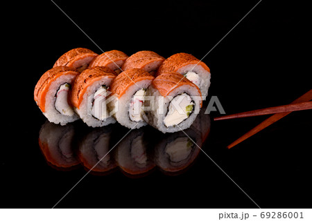 Fresh sushi rolls prepared from the best varieties of fish and seafood Fresh sushi rolls prepared from the best varieties of fish and seafood 69286001