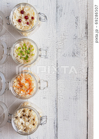 Sauerkraut jars on wooden table with copy space 69286507