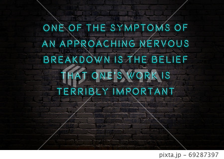 Wise quote. Neon inscription against brick wall 69287397