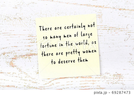 Wise quote on sticky note on wooden wall  69287473