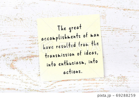 Wise quote on sticky note on wooden wall  69288259