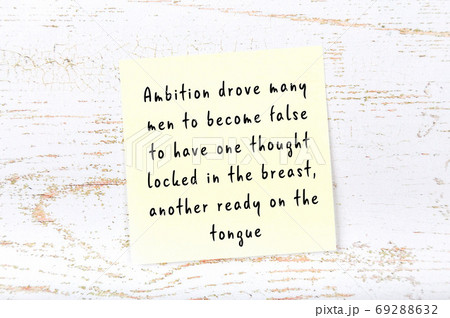 Wise quote on sticky note on wooden wall Wise quote on sticky note on wooden wall 69288632