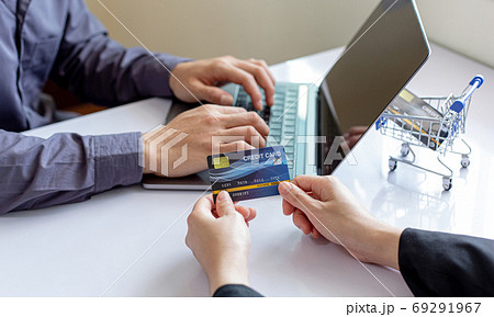 Both business people use laptop and phones to register online purchases using credit card payments, Convenience in the world of technology and the internet, Shopping online and banking online concept. 69291967