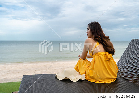 woman relaxing on a chair in Hua Hin beach, Thailand 69296428