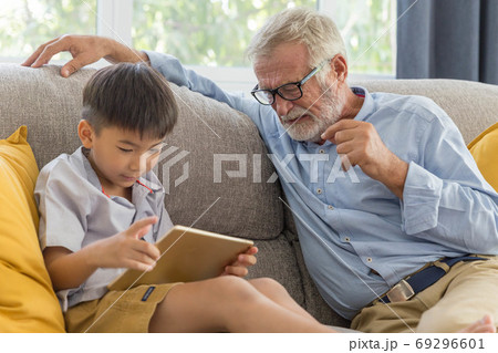 Grandfather and little cute grandson playing 69296601