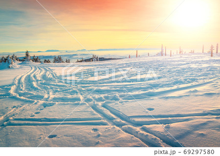 Beautiful winter sunset landscape and road with covered snow 69297580