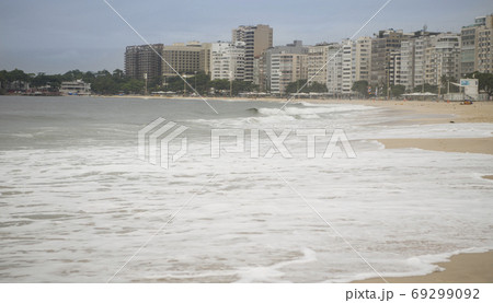 Rio de Janeiro, Brasil- February 28, 2020: Citizens swim and sunbathe on the beach of Copacabana 69299092