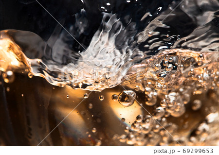 white wine in glass on black background 69299653