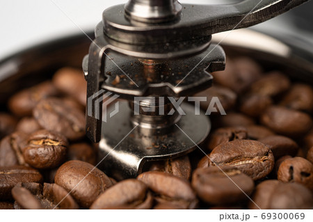 Coffee bean roasted in wooden grinder. Coffee bean roasted in wooden grinder. 69300069