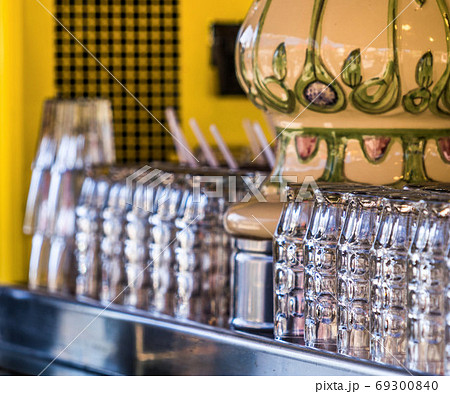 Freshly rinsed clean beer glasses stand on a counter Freshly rinsed clean beer glasses stand on a counter 69300840