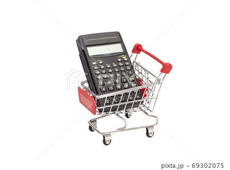 Calculator in shopping trolley cart isolated on white.Financial concept. Calculator in shopping trolley cart isolated on white.Financial concept. 69302075