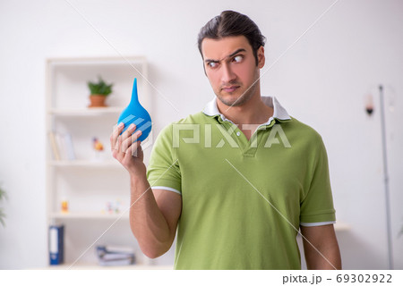 Young man waiting for doctor in the clinic 69302922