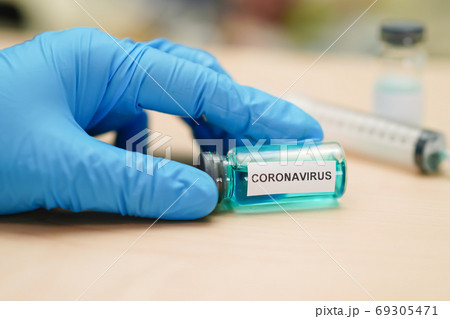 Novel Coronavirus (2019-nCoV) vaccine development medical with syringe for doctor Novel Coronavirus (2019-nCoV) vaccine development medical with syringe for doctor 69305471