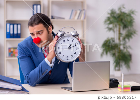 Funny employee clown working in the office 69305517
